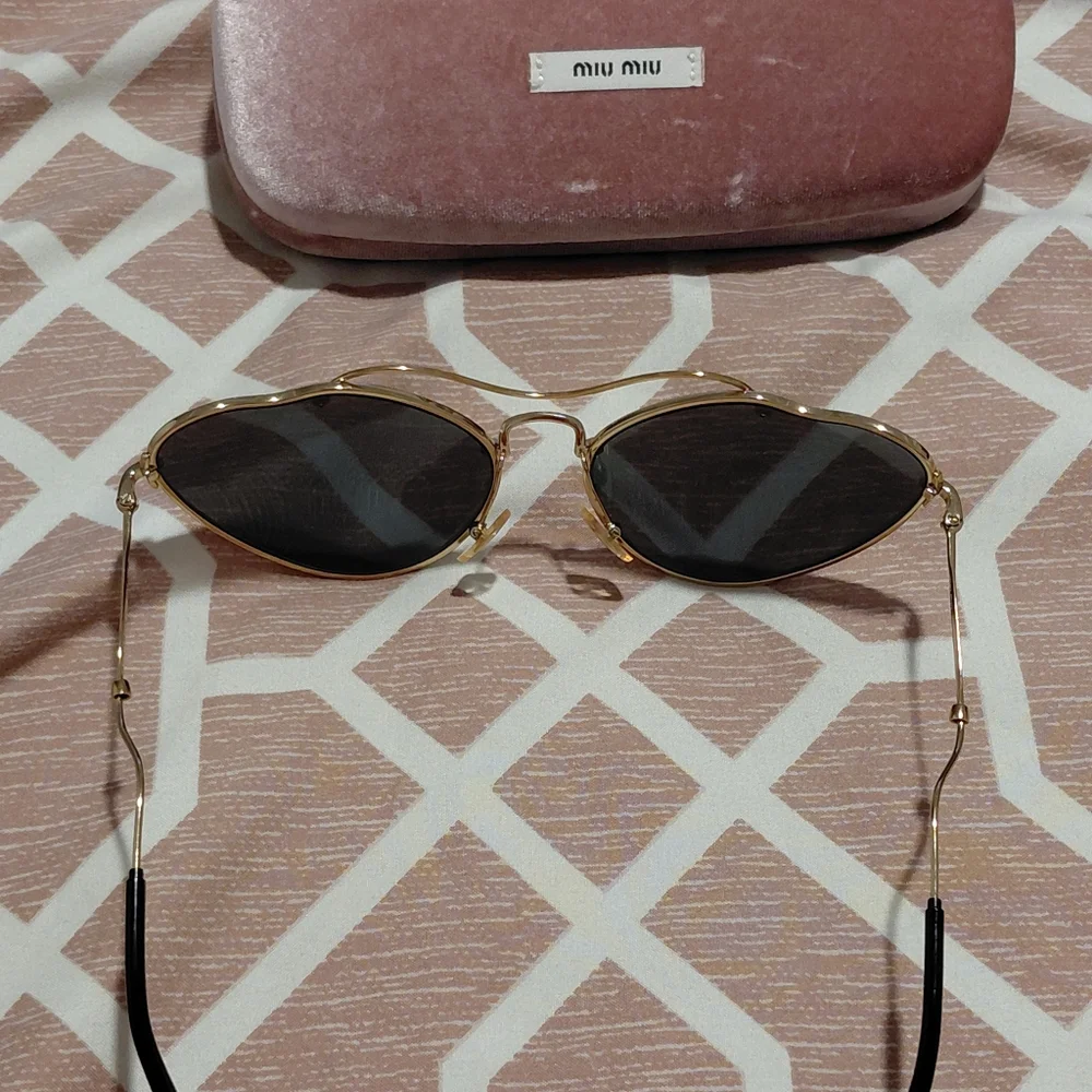 Miu Miu Gold Frame Sunglasses with Black Lenses